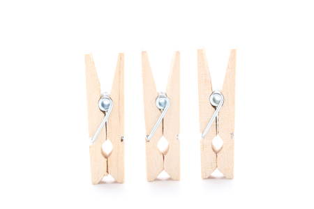 Wooden clothespins isolated on white backgroundの写真素材