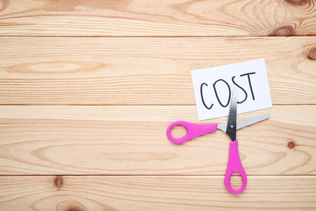 Paper with word Cost and scissors onの写真素材