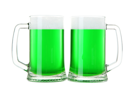 St. Patrick's Day. Glass mugs with green beer isolated on white backgroundの写真素材