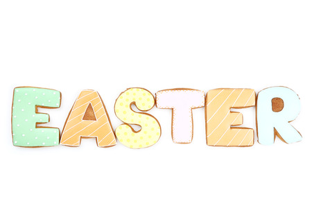 Word Easter by gingerbread cookies isolated on white backgroundの写真素材