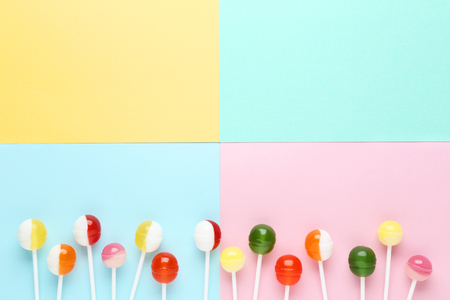 Sweet lollipops on colorful backgroundの写真素材