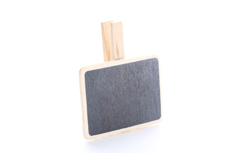Clothespin with blackboard isolated on white backgroundの写真素材