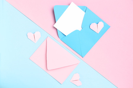 Paper envelopes and hearts on colorful backgroundの写真素材