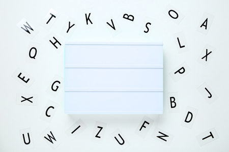 Blank lightbox with letters on white backgroundの写真素材