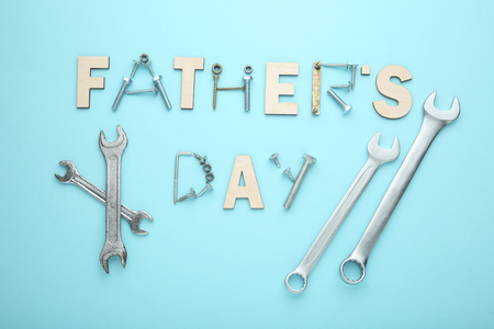 Inscription Fathers Day with tools on blue backgroundの写真素材