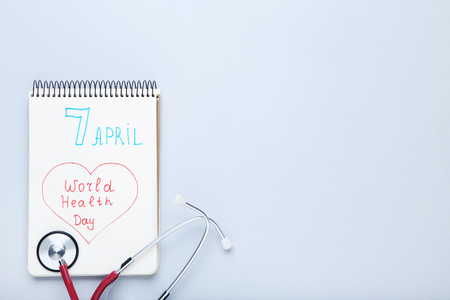 Text World Health Day with stethoscope on grey backgroundの写真素材