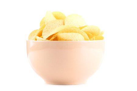 Potato chips in bowl isolated on white backgroundの写真素材