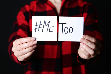 Woman holding paper with text Me Tooの写真素材
