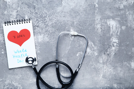 Text 7 April and World Health Day with stethoscope on grey wooden tableの写真素材