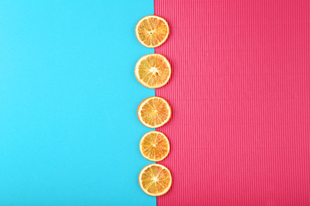 Dried orange fruits on colorful background