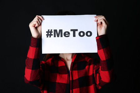 Woman holding paper with text Me Tooの写真素材
