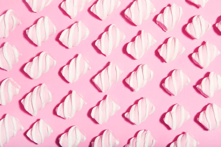Sweet marshmallows on pink background. Minimalism conceptの写真素材