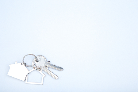 Silver keys with house symbol on grey backgroundの写真素材