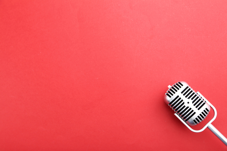 Vintage microphone on red backgroundの写真素材