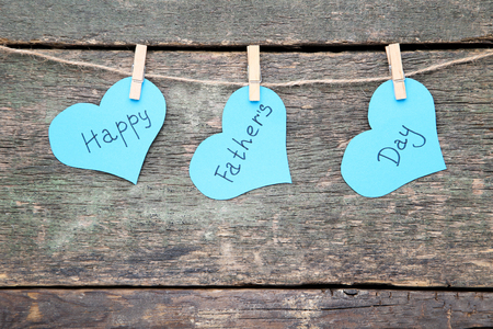 Text Happy Fathers Day hanging on wooden backgroundの写真素材