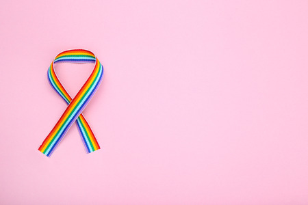 Rainbow ribbon on pink backgroundの写真素材