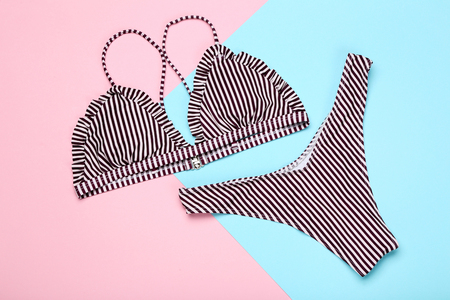 Fashion swimsuit on colorful backgroundの写真素材