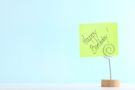Paper with text Happy Birthday on blue backgroundの写真素材