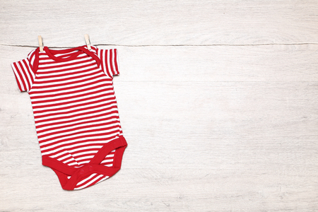 Red baby bodysuitの写真素材
