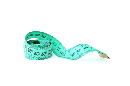 Green measuring tape isolated on white backgroundの写真素材