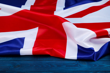 British flag on blue wooden table