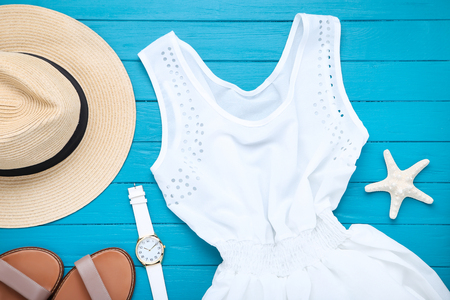 Fashion clothing with starfishes on blue wooden tableの写真素材