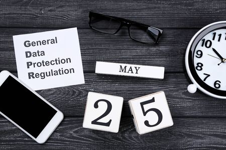 General Data Protection Regulation, GDPR with cube calendar, smartphone and glasses