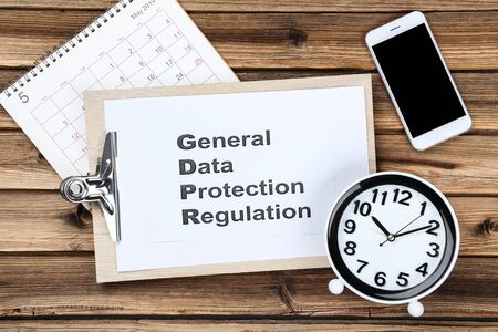 General Data Protection Regulation, GDPR with smartphone and round clockの写真素材