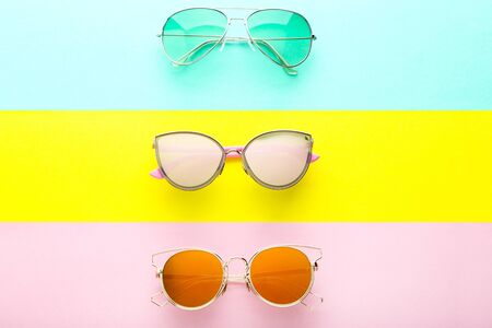 Modern sunglasses on colorful backgroundの写真素材