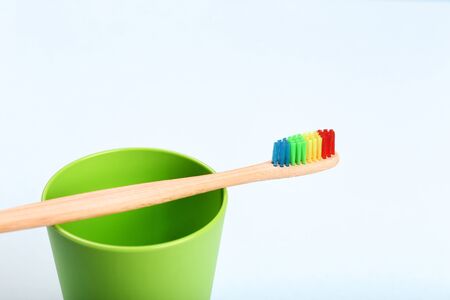 Bamboo toothbrush with green basketの写真素材