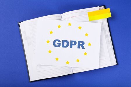 General Data Protection Regulation, GDPR with notepad on blue background