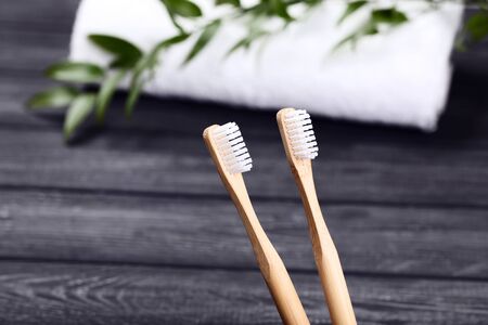 Bamboo toothbrushes on black background