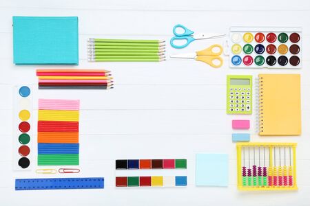 School supplies on white wooden tableの写真素材