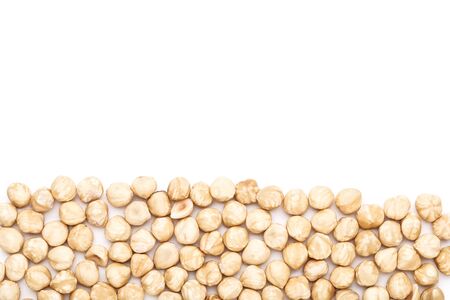 Peeled hazelnuts on isolated white backgroundの写真素材