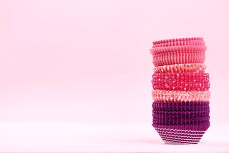 Cupcake cases on pink backgroundの写真素材