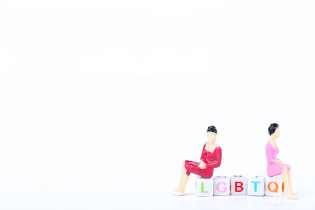 Miniature people with abbreviation LGBT on white backgroundの写真素材