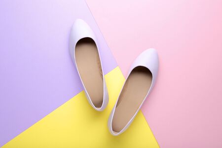 Purple female shoes on colorful backgroundの写真素材