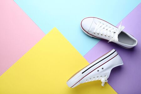 Pair of white sneakers on colorful backgroundの写真素材