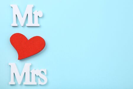 White letters Mr and Mrs with red heart on blue backgroundの写真素材