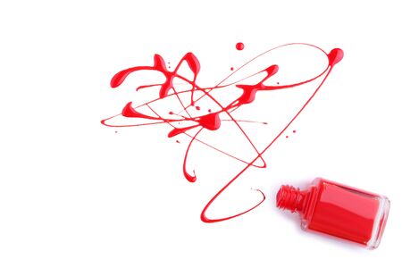 Nail polish splatters and bottle isolated on white backgroundの写真素材
