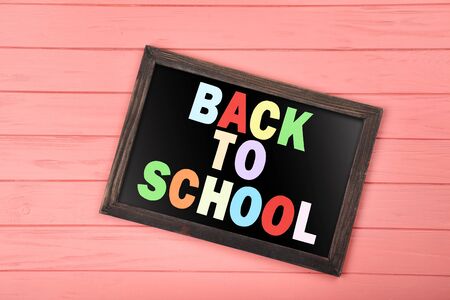 Text Back To School on wooden table