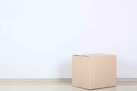 Cardboard box on grey background