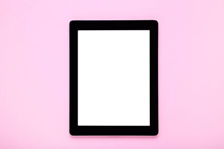 Tablet computer on pink backgroundの写真素材