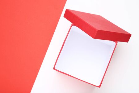 Open red gift box on colorful backgroundの写真素材