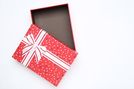Open red gift box on white background