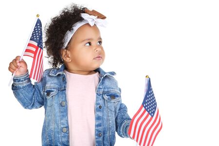 Beautiful baby girl with american flags on white background