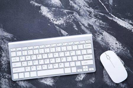 Computer keyboard and mouse on wooden tableの写真素材