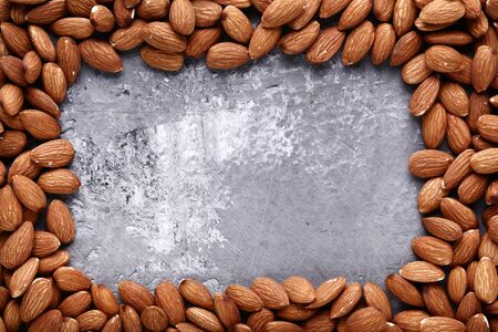 Almonds on grey wooden tableの写真素材