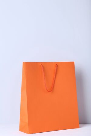 Paper shopping bag on grey backgroundの写真素材