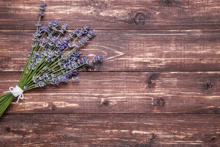 Lavender flowers on brown wooden tableの写真素材